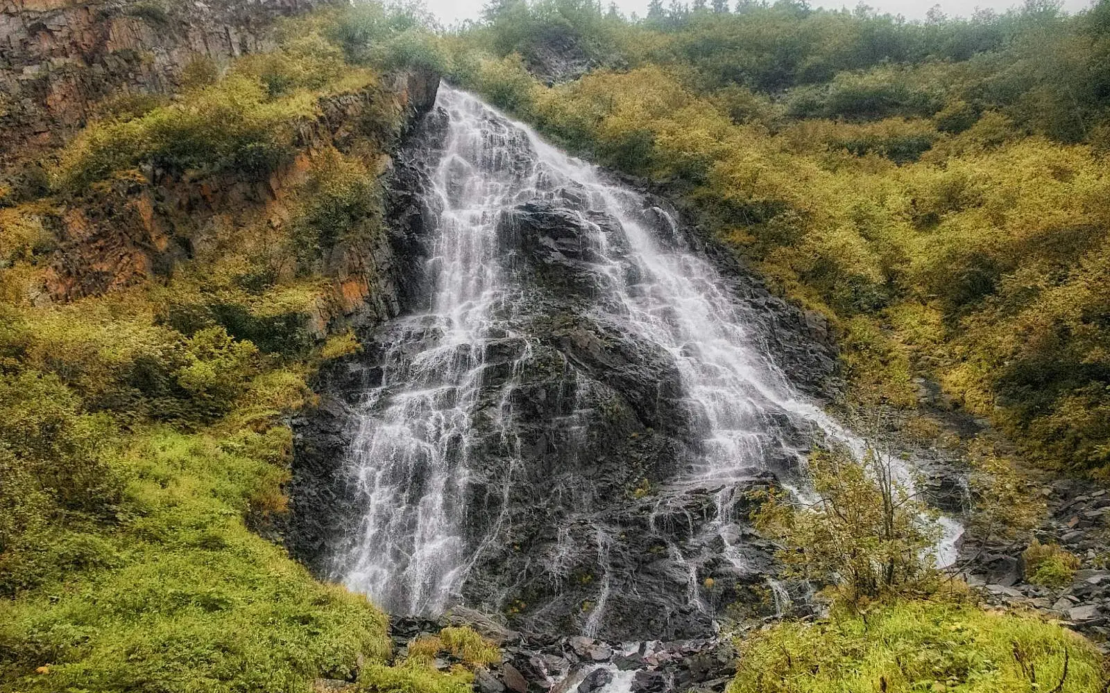 Horsetail Falls flowing through autumn vegetation